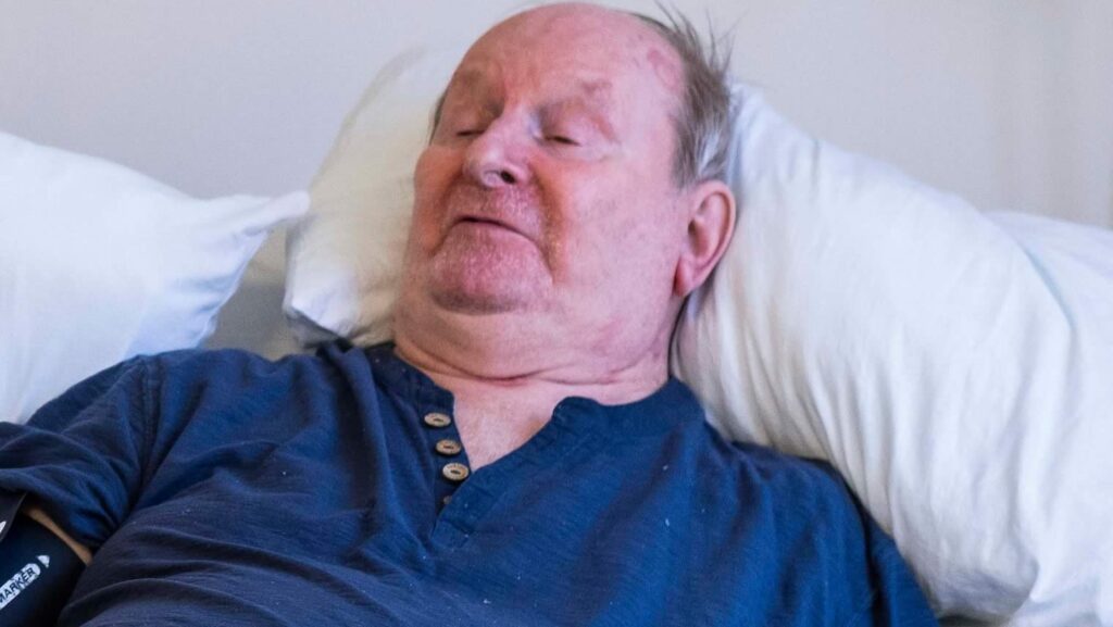 Patient lying in hospital bed